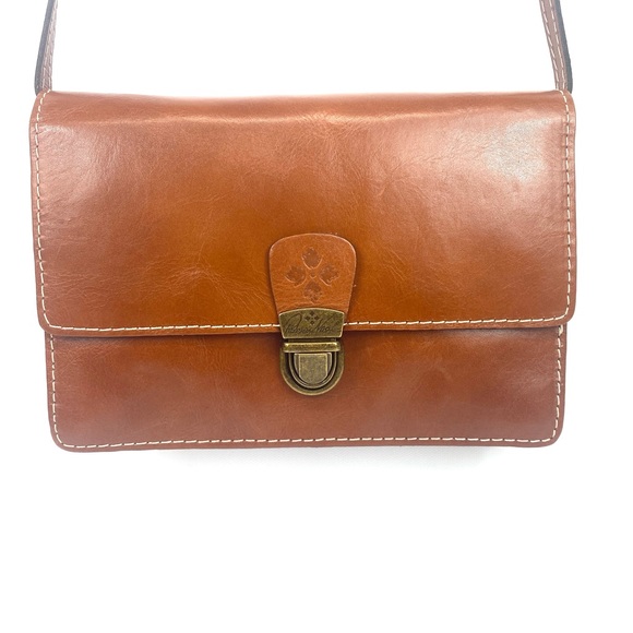 Patricia Nash Lanza Crossbody Organizer
Tan w crossbody strap and wristlet - NWT - Picture 4 of 17